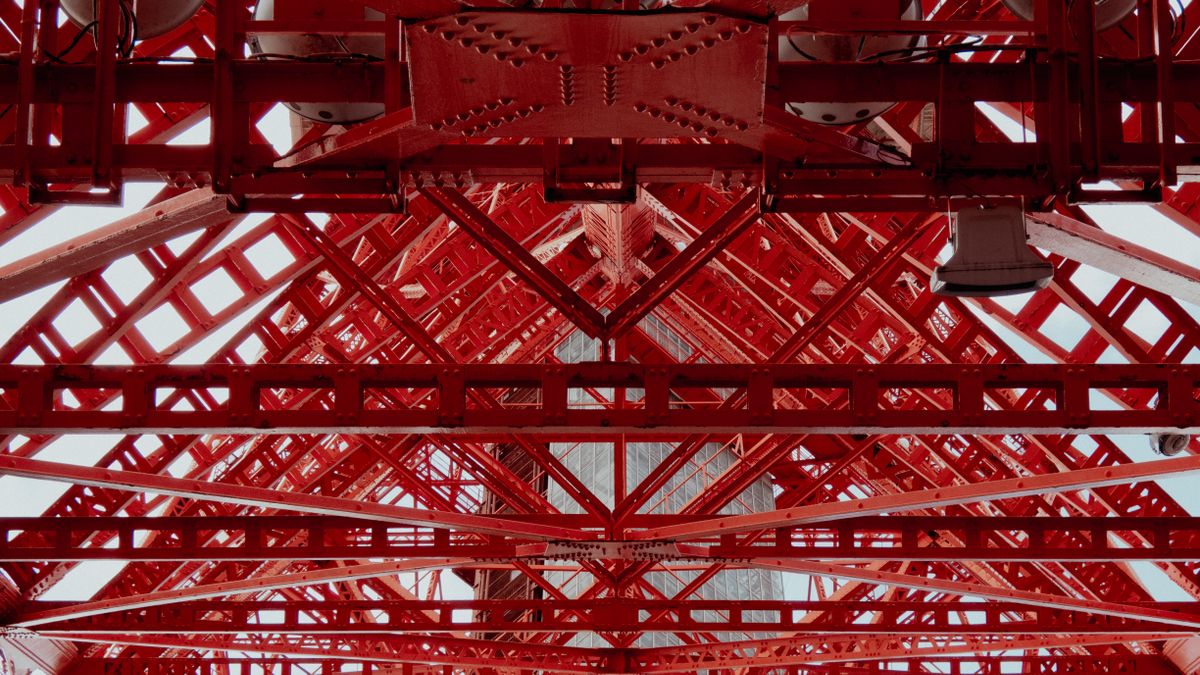 Red structural steel beams, bracing and bolted connections